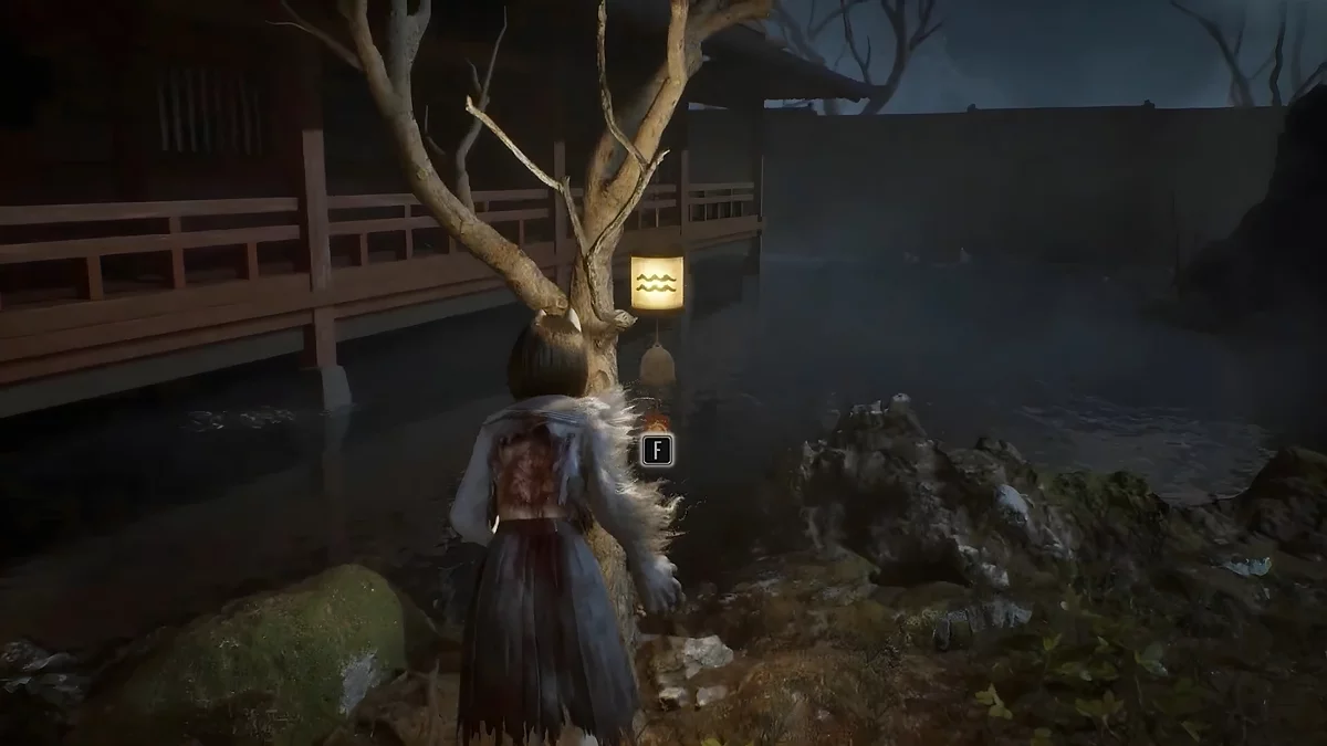 Фонарь с символом волн у овального камня Silent Hill f